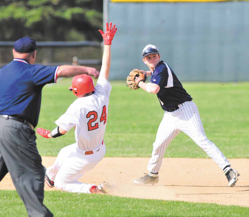 Leetonia shortstop Nick Altomare throws to first base after retiring Columbiana baserunner Bryce Miner during Tuesday’s tournament game at Firestone Park. The Clippers won, 7-1. 
