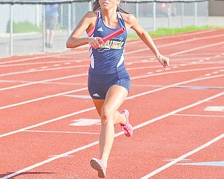 Ashley Moore carries the baton for Lowellville in the girls’ 4x100-meter relay race during the ITCL Tier 2 track meet Wednesday. The Lowellville girls took home second place in the overall team competition.
