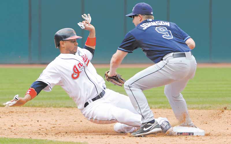Cleveland Indians base runner Orlando Cabrera is picked off second by Tampa Bay Rays second baseman Elliot Johnson in the sixth inning of a baseball game in Cleveland on Thursday,  May 12, 2011.   (AP Photo/Amy Sancetta)