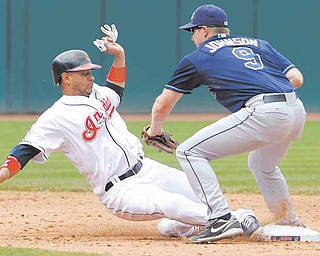 Cleveland Indians base runner Orlando Cabrera is picked off second by Tampa Bay Rays second baseman Elliot Johnson in the sixth inning of a baseball game in Cleveland on Thursday, May 12, 2011. (AP Photo/Amy Sancetta)