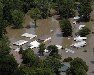 Houses and property along the Mississippi River near Tunica, Miss., are flooded by the Mississippi River, Wednesday, May 11, 2011. Gov. Haley Barbour and other officials took an aerial trip along the Mississippi River and some of its tributaries to view the spreading damage from the flood waters.