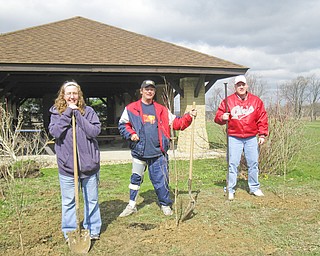 To mark Earth Day and Arbor Day, three dogwood trees were planted near the Paul Pogany Pavilion in Austintown Township Park. Celebrating our planet and working together to complete the down-to-earth project were, from left, Samantha, Jim and Nathan, from No Limits and Ginnetti Center, alternative day habilitation programs offered by Turning Point Residential Inc. The group will continue to work with Joyce Gottron, park supervisor, and her staff on more park beautification projects throughout the year.