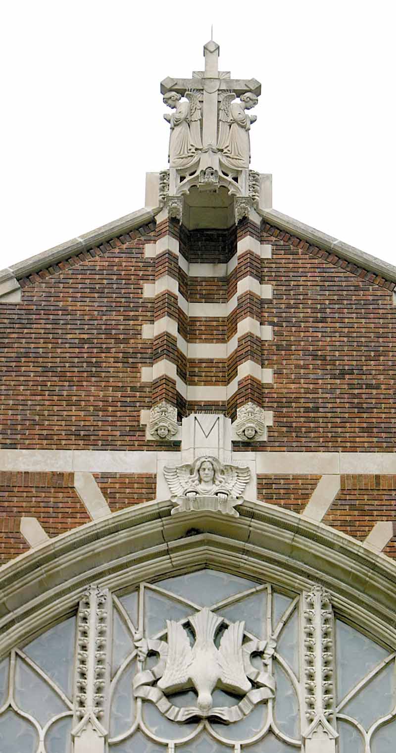 The edifice of St. Patrick Church, 1420 Oak Hill Ave., Youngstown, reaches toward heaven with a cross flanked by two angels. The brick and stone church in a Gothic design was dedicated in 1926. The first church was a California mission-style built in 1911.