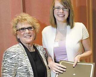 Megan Chambers, who graduates next month from Boardman High School, poses with Cynthia Anderson, Youngstown State University president. Chambers is one of a new group of Leslie H. Cochran University Scholars recognized Friday at YSU.