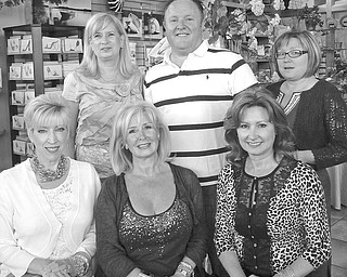 Prepared for two shopping-filled evenings at Fellows Riverside Gardens during a Girls Night Out at the Gardens event to be sponsored by the Friends of Fellows Riverside Gardens are committee members, from left in front, Becky Tenant; Jeanne Simeone, Shop in the Gardens buyer; and Beverly Gronvall, and in back, Telva Maslach; David Armstrong, of Cater 2 U; and Lori Mowad.