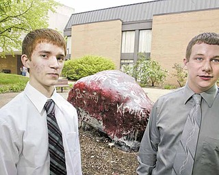 Philip Monrean, left, of Ursuline High School and Andrew Stamp of Struthers High School are among the 40 students who comprise Youngstown State University’s 19th class of University Scholars. They talked about the honor near the rock on the YSU campus.