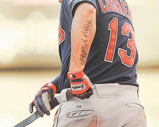 Cleveland Indians' Asdrubal Cabrera (13) dons a new belt during the first inning of a baseball game against the Kansas City Royals in Kansas City, Mo., Monday, May 16, 2011. Cabrera broke his belt sliding into second base.