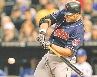 Cleveland Indians' Travis Hafner hits a three-run double off Kansas City Royals relief pitcher Vin Mazzaroof during the fourth inning a baseball game in Kansas City, Mo., Monday, May 16, 2011.