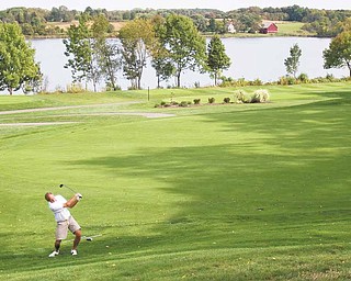 Dick Marlowe, Tippecanoe Country Club, hits to the 18th green at The Lake Club during last year’s inaugural Greatest Golfer of the Valley tourney. The 2011 finals will be played at Lake on Sunday, Aug. 28.