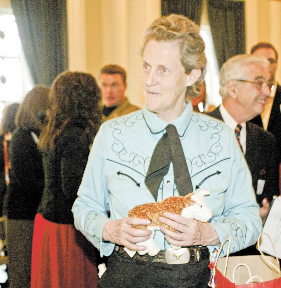 Temple Grandin greets guests at the reception before her Tuesday night speech at a sold-out Stambaugh Auditorium. The animal scientist and author talked about her career in the livestock industry, her life with autism and other topics.