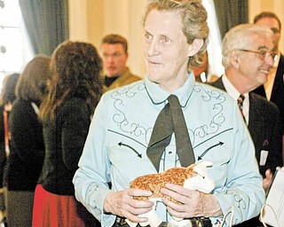 Temple Grandin greets guests at the reception before her Tuesday night speech at a sold-out Stambaugh Auditorium. The animal scientist and author talked about her career in the livestock industry, her life with autism and other topics.