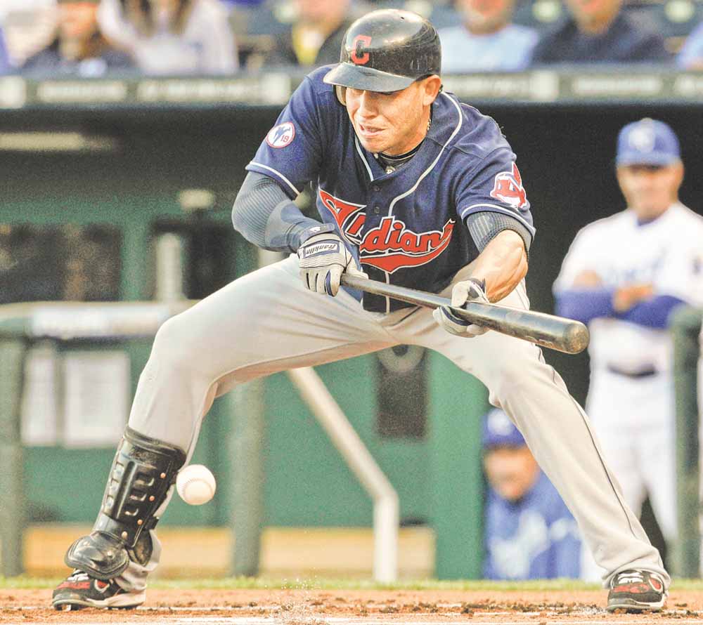 Cleveland Indians' Asdrubal Cabrera bunts during the first inning of a baseball game against the Kansas City Royals in Kansas City, Mo., Tuesday, May 17, 2011. The bunt advanced teammate Michael Brantley to third base. 