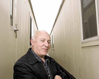 Mal Culp, Austintown schools supervisor of facilities and operations, stands outside two classroom trailers to be installed on school grounds. The trailers will house the libraries and computer labs for Frank Ohl Intermediate and Watson Elementary schools for the next two years while new buildings are constructed.