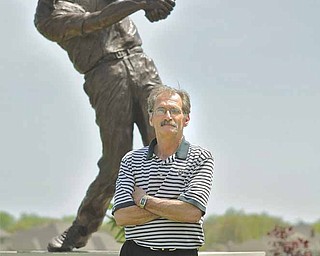 Paul Otto stands in front of a statue at the entrance of Kennsington Golf Club in Canfield. Otto, the third
general manager of the course in as many years, has been around golf since he was eight — 50 years ago.