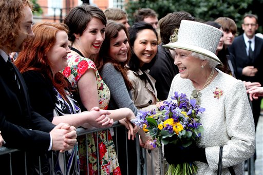 Britain's Queen Elizabeth II meets students and staff at Trinity College Dublin, Tuesday May 17, 2011. The Queen set foot on Irish soil at the start of a historic state visit which will herald a new era in relations between Britain and the Republic. Politicians on both side of the Irish Sea have described the four-day event as momentous.