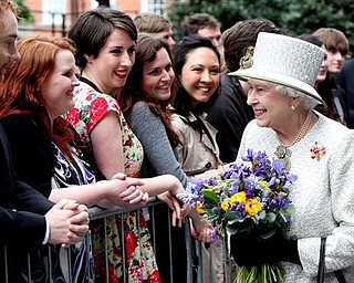 Britain's Queen Elizabeth II meets students and staff at Trinity College Dublin, Tuesday May 17, 2011. The Queen set foot on Irish soil at the start of a historic state visit which will herald a new era in relations between Britain and the Republic. Politicians on both side of the Irish Sea have described the four-day event as momentous.