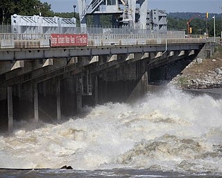 Water from the Mississippi River roars through the Old River Control Structure towards the Atchafalaya Basin in Concordia Parish, La., Tuesday, May 17, 2011. The structure's gates were opened to help relieve rising floodwaters from the Mississippi.