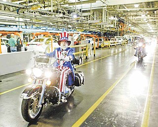 William D. Lewis The Vindicator Gary "Bones" Mowen, a GM Lordstown retiree, leads a group of more thn 30 motorcycles through the GM plant early Thursday morning during the 15 th annual GM Lordstown Bike Show. The event raised money for the March Of Dimes Charity. Mowen, an avid rider is known for wearing an Uncle Sam costume while riding his motorcycle.