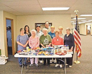The members of Austintown Senior Center recently donated and shipped care packages for troops overseas. Lucy Caruso, a Youngstown State University student intern at the center, organized the collection and shipment of the donated items. She has a brother serving with the Marines in Afghanistan. In the front row, from left to right, are Joann Lipkovich, Dorothy Schultz, Faye Marciano, Roselynn Ferranti and Mary Sponagle. In the back row are Caruso; Alex Panno; Bill Adams, director of the senior center; Ruth McAndrews and Jeannette Hitt.