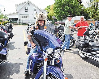 J.R. Blakeman of Perry Township with his bike Saturday afternoon at  St. Dominic Church.