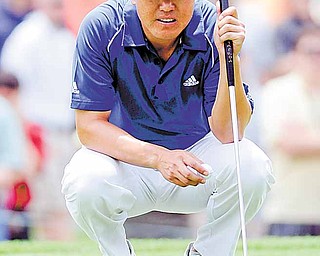 Charlie Wi, of South Korea, lines up a putt on the second hole during the third round of play at the Colonial golf tournament in Fort Worth, Texas, Saturday, May 21, 2011.