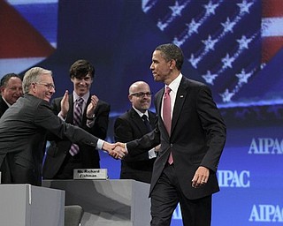 President Barack Obama is welcomed by delegates as he arrives to speak at the American Israel Public Affairs Committee (AIPAC) convention in Washington, Sunday, May 22, 2011.