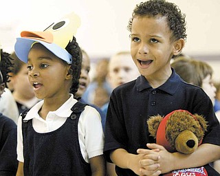 Williamson Elementary School kindergarten students Dream Jones and Elijah Lamar sing during a program Monday at the school. The ceremony, which celebrated mothers, was sponsored by the English as a Second Language program.
