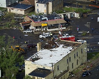 This aerial view shows tornado damage in Minneapolis, Sunday, May 22, 2011. At least one person died when the tornado barreled through the residential portion of Minneapolis on Sunday, damaging at least 100 homes, toppling hundreds of trees and injuring at least 29 people. 