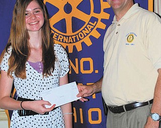 Champion speller: Lauren Ritz, 13, of New Castle, Pa., a seventh-grader at Willow Creek Learning Center in Poland, was awarded a $100 savings bond at the scholarship luncheon hosted by Rotary Club of Youngstown May 11 at the Youngstown Club. Ritz, daughter of Lisa and Stephen Ritz, was named champion of The Vindicator’s 78th Regional Spelling Bee after 69 rounds of competition at the Chestnut Room of Kilcawley Center at Youngstown State University. Making the presentation was Steve Kristen, president of the Rotary club.