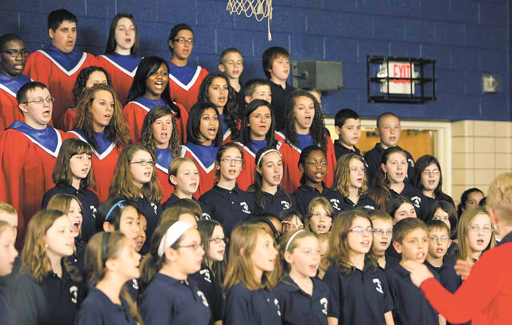 Austintown Fitch High School and Frank Ohl Intermediate School choirs sang the national anthem on Tuesday as school officials broke ground on a $50 million building project. The Ohio School Facilities Commission is funding about 47 percent of the project, and Austintown schools will fund the rest through a 2.9-mill bond issue passed by voters in May 2010.