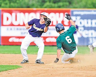 Anthony Rohan (6) of Ursuline slides safely into second base on a steal, beating the tag of Champion’s second basemen, Tyler Chinchic.
