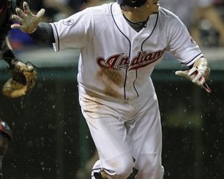 Cleveland Indians' Asdrubal Cabrera watches his RBI-double in the eighth inning of a baseball game against the Boston Red Sox on Monday, May 23, 2011, in Cleveland. 