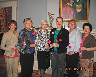 A tour of duty: Warren-Trumbull County American Association of University Women had its May meeting at the historic Harriet Taylor Upton House in Warren. After a tour of the house, officers for the coming season were installed. Receiving carnations as they accepted the responsibility of various offices were, from left, Mary Ognibene, secretary; Katylu Herriman, co-vice president for programs; Roz Jackson, member-at-large; Isabel Seavey, president; Bobbi Buehrle, member-at-large; and Diana Bauman, co-vice president for programs. Anyone interested in becoming a member of the organization should call 330-898-3696. 