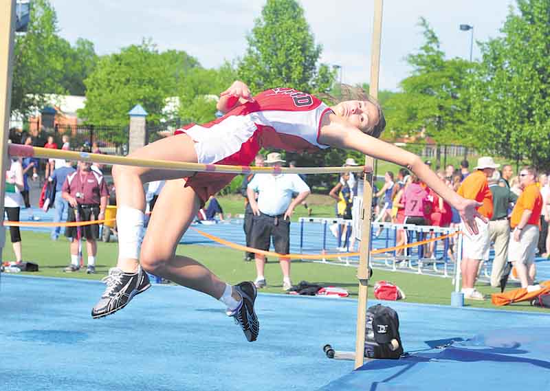Girard's Ashley Wagner clears the bar during the high jump during the regional track meet at Ravenna High School.