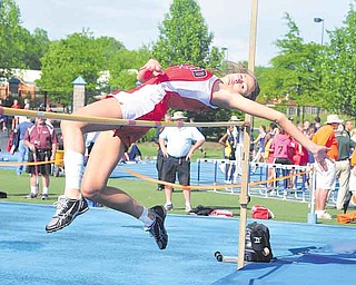 Girard's Ashley Wagner clears the bar during the high jump during the regional track meet at Ravenna High School.
