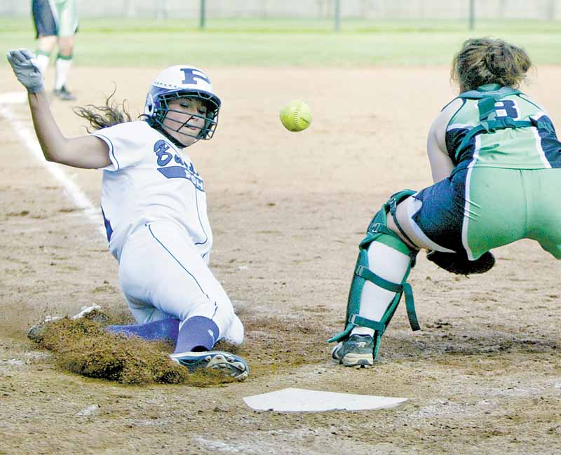 Poland's Kalie Benson slides into home to score as West Branch catcher Cheyenne Miller waits for the throw.