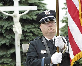Youngstown Patrolman Richard Baldwin was part of the color guard at the annual Fallen Officers Memorial ceremony at Our Lady of Mount Carmel Church, Youngstown.