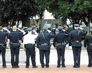 Youngstown police officers salute those who lost their lives in the line of duty. Mahoning County Fraternal Order of Police Lodge 141, Youngstown FOP Lodge 28 and Youngstown State University FOP Lodge 200 sponsored the event.