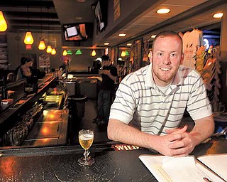 Neale Booth, nephew of Bill and Melissa Booth, is a bartender at Backyard Bar and Grill. The establishment, on State Route 170, just south of Western Reserve Road, opened recently after Bill and Melissa Booth said they wanted to bring a family-friendly bar and grill to town.