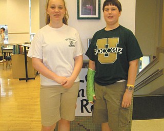 Excellent scientists: St. Patrick School in Hubbard sent two students to the State Science Day in Columbus, hosted by Ohio State University. Gabriella Hosack, at left, an eighth-grader, presented her project, “The effect of enhanced water on the athletic ability of mice.” Her project received a perfect score and The Ohio Academy of Science Superior Award. Jack Sebest, a seventh-grader, at right, presented his project, “The efficient use of force and momentum in a trebuchet,” which received the OAS Excellence Award.