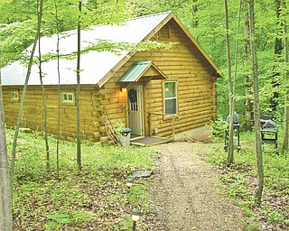 At the Bears Den Lodge guests can reserve the Aspen Cabin that sleeps up to four guests. The property sits on more than 600 acres surrounded by woodlands, rolling hills and three fully stocked fishing ponds. 