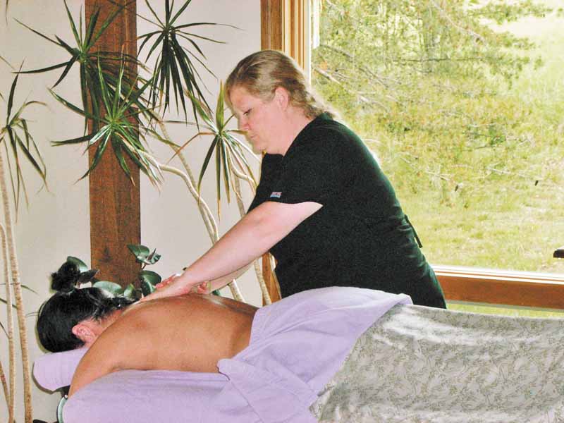 Holli Aneshansley, owner of The Natural Remedies Spa, gives Stacey Willis an aromatherapy massage.