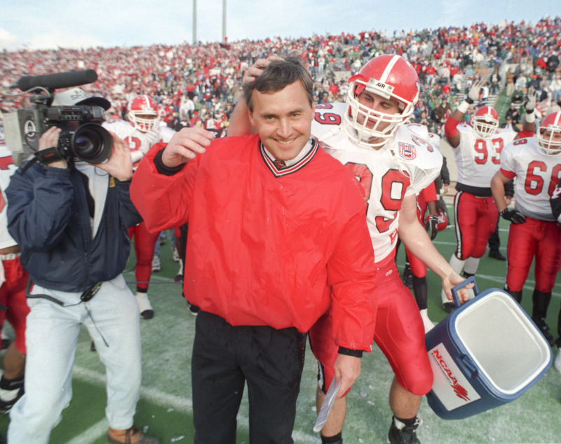 Jim Tressel gets a playful pat on the head from a player who missed him with the Gatorade bucket following the Penguins 1994 Div I-AA National Championship win over Boise State.