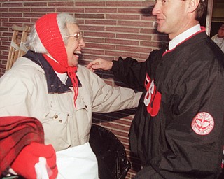 Jim Tressel gets a hug from his mother Eloise after deafeating Washington State to advance to the Div I-AA national championship game in 1997.