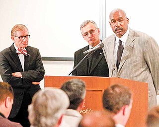 FILE- In this March 8, 2011 file photo, Ohio State athletic director Gene Smith, right, takes questions during a news conference with university president E. Gordon Gee, left, and football coach Jim Tressel, center, in Columbus, Ohio. Smith, unable to talk about the ongoing NCAA investigation, does touch upon some fine points of the suspensions of football coach Jim Tressel and five of his players. (AP Photo/Terry Gilliam, File)