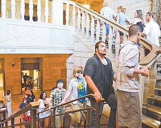Chaney High School’s graduating seniors practice the procession into Stambaugh Auditorium, where they will receive their diplomas today.
