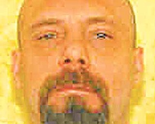 This undated photo provided by the Ohio Department of Rehabilitation and Correction shows death row inmate Kenneth Smith. The 45-year-old Smith is scheduled to die July 19 for killing Lewis and Ruth Ray in their Hamilton home in 1995. Ohio will make it easier for a Smith who lost his larynx to cancer to make a final statement at his execution, a gesture of flexibility the state argues is one more reason a federal judge should dismiss a lawsuit challenging Ohio's execution procedures(AP Photo/Ohio Department of Rehabilitation and Correction)