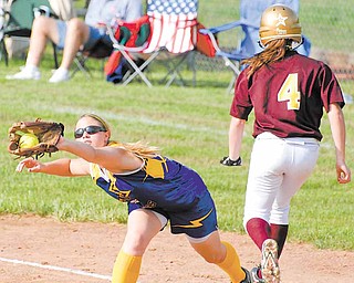 Haley McAllister, seen above reaching for a throw, and her teammates on the undefeated 2011 Champion softball team are trying to do what the 2006 team could not: leave the state tournament with a championship trophy. They could move closer to their goal today against Bellville Clear Fork in a Division III state semifinal game.