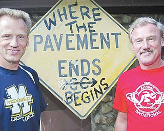 Maplewood cross country coach Ted Rupe, right, will coach the Rockets for the last time at this weekend’s state track meet in Columbus. Ted Rupe is retiring after 32 years during which time he took an already-successful program and turned it into one of the best in Ohio’s history. The only program that can compete with that run of success is the one at McDonald, which is coached by his younger brother, Chris Rupe, at left.