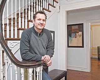 Stager Mark Miklosovich stands in the Wynnewood home that he and his partner, Anna Powers, worked on. The two "suggest things," Powers said - "for instance, adding a piece of furniture." (Akira Suwa/Philadelphia Inquirer/MCT)